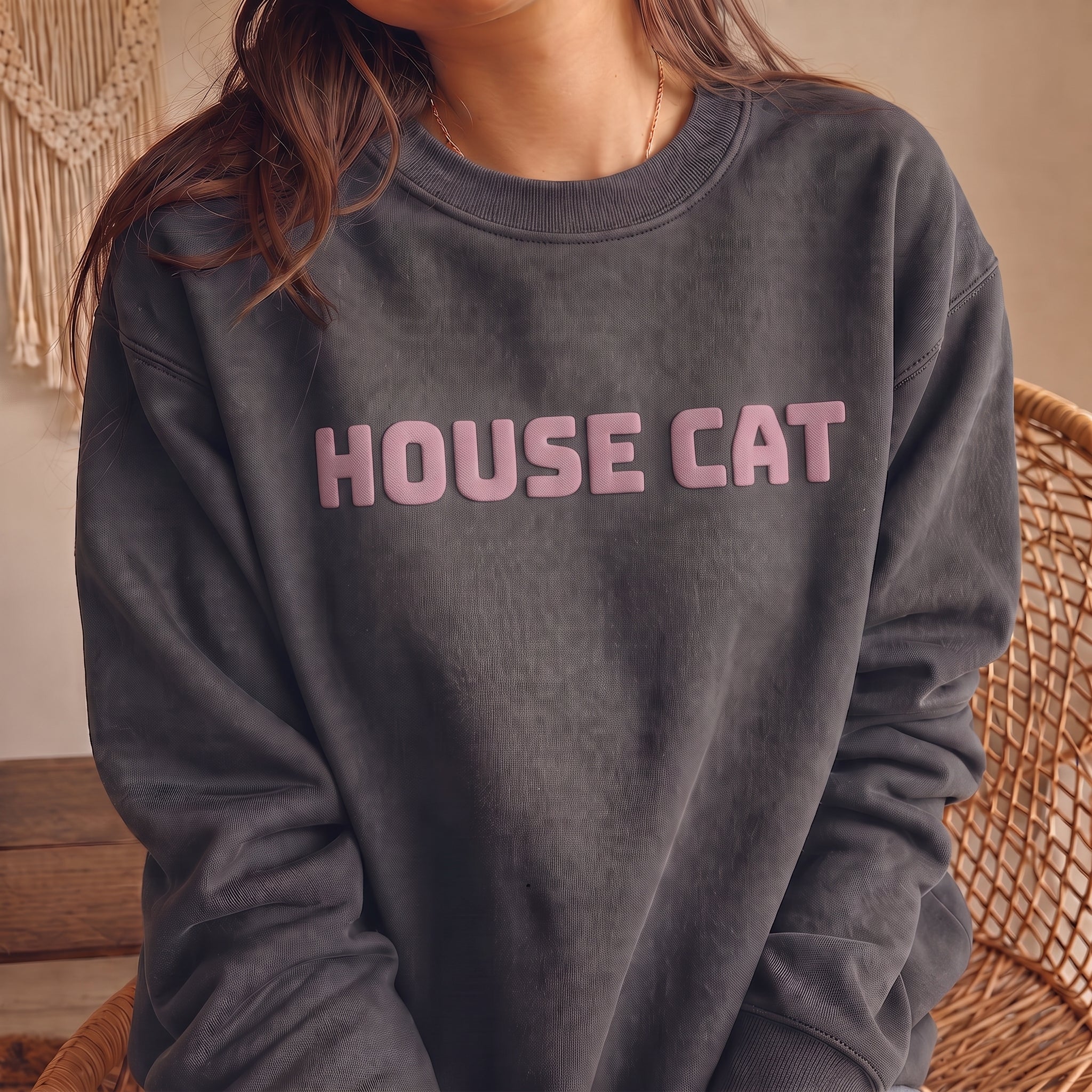 Charcoal HOUSE CAT graphic sweatshirt modeled with raised contrast puff lettering, soft unisex cat lover pullover for cozy casual everyday outfits.