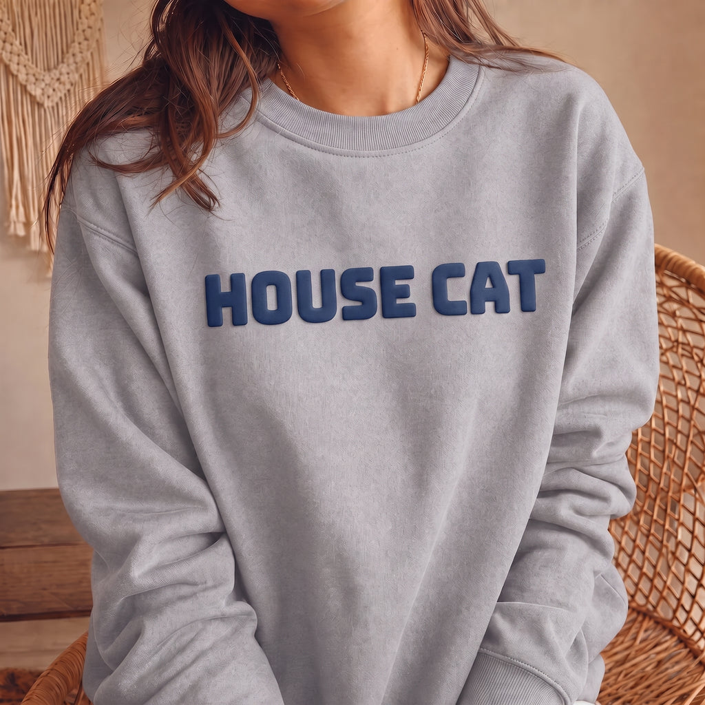 Gray HOUSE CAT puff print sweatshirt shown on model with contrasting navy chest lettering, soft unisex cat crewneck and cat lover gift idea.