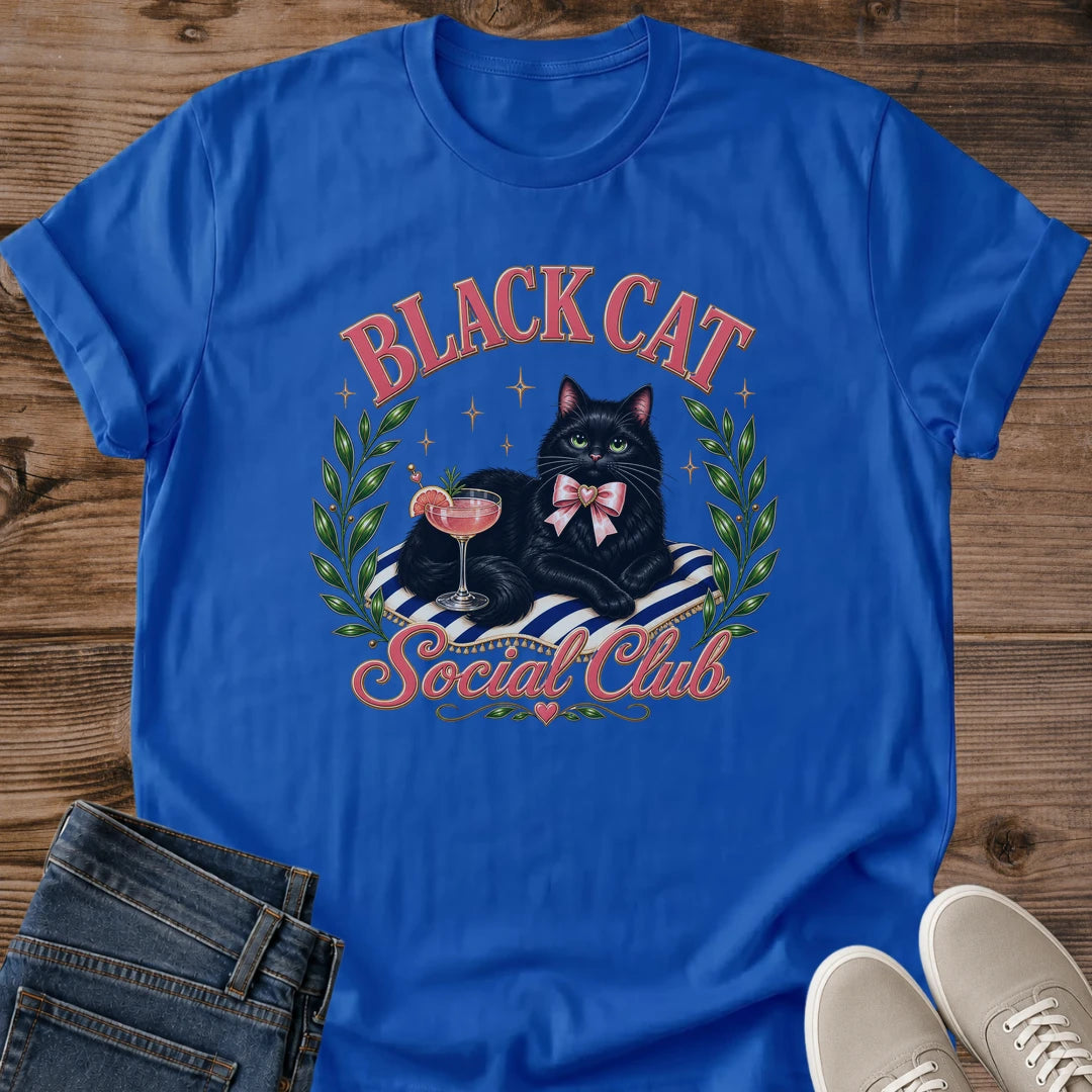 Coquette Style Graphic Tee Black Cat Design Women Shirt Feminine Aesthetic Fashion Luxurious Cat Green Eyes Pink Cocktail Glass Detail Striped Cushion Pink Bow Accent Olive Wreath Frame Cat Lover Gift Perfect Casual Wear Cute Animal Themed