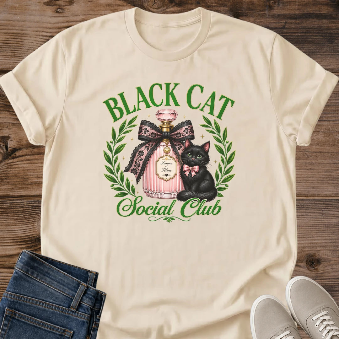 Graphic Tee Women Black Cat Design Coquette Aesthetic Shirt With Perfume Bottle Art Green Eyes Cat Detail Feminine Fashion Statement Pink Bow Accent Laurel Wreath Frame Cat Lover Gift Idea Casual Wear Essential Soft Girl Style Unique Design