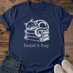 Cat Lover Gift Soft Cotton Crew Neck Tee Shirt Featuring Hand Drawn Cat Illustration Design Atop Book Stack Perfect Present For Book Lovers Comfortable Lightweight Ring Spun Cotton Construction Vintage Style Muted Contrast Artwork Cozy