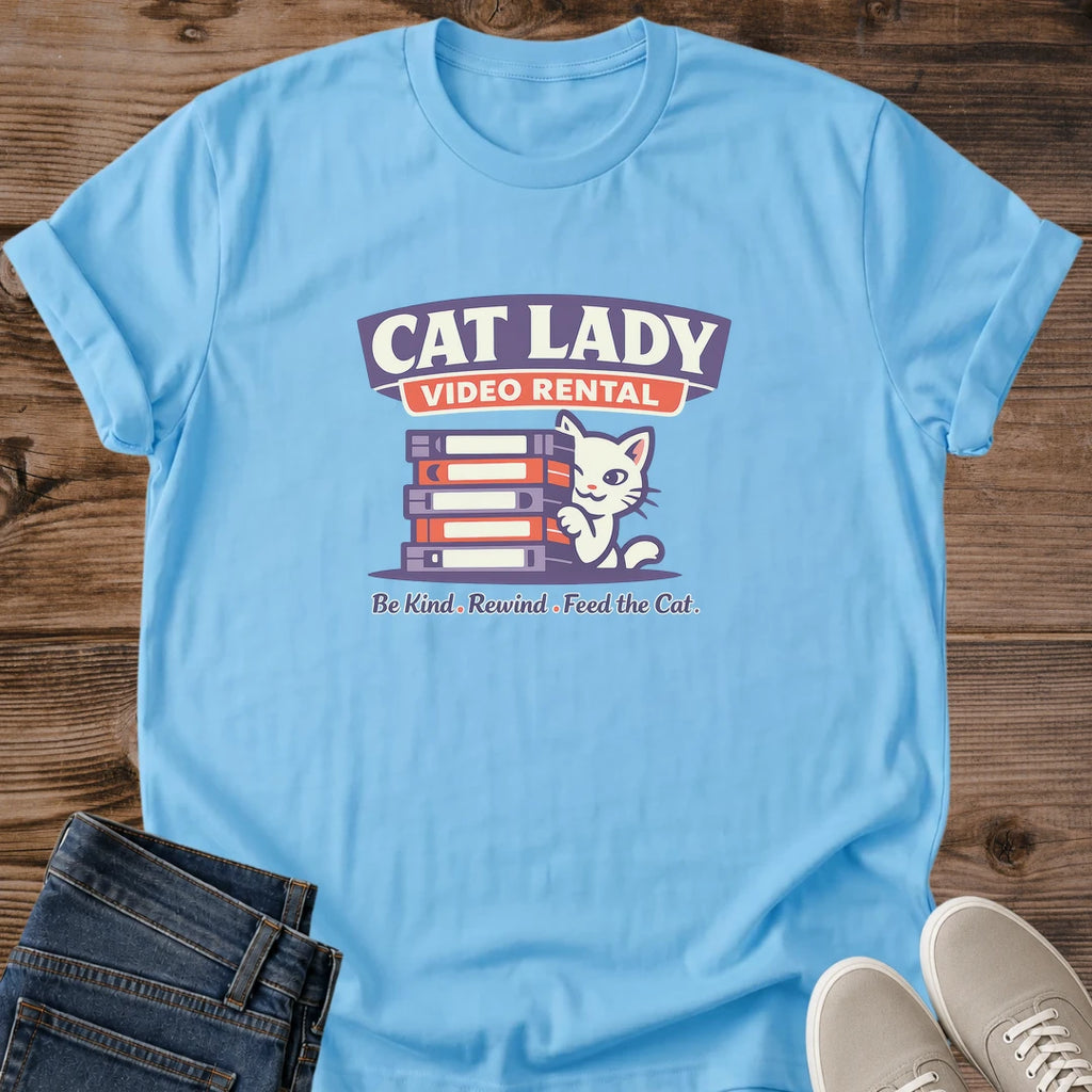 White Cat Graphic Tshirt Retro Video Rental Design Nostalgic VHS Theme Vintage Movie Lover Shirt Soft Cotton Fabric Relaxed Fit Casual Wear Comfortable Everyday Apparel Perfect Cat Lady Gift Unique Birthday Present Film Enthusiast Fashion