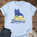 Blue Cat Graphic Tee Illustrated Cat Lover Shirt Whimsical Design Retro Script Typography Soft Lightweight Fabric Comfortable Casual Wear Wide Eye Cat Art Bold Print Quality Everyday Statement Piece Perfect Pet Parent Gift Weekend Lounging