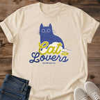 Whimsical Cat Design Illustrated Graphic Tee Blue Cat Lover Shirt Retro Typography Style Soft Lightweight Fabric Wide Eye Art Comfortable Casual Wear Perfect Pet Parent Gift Everyday Statement Piece Weekend Lounging Essential Coffee Shop