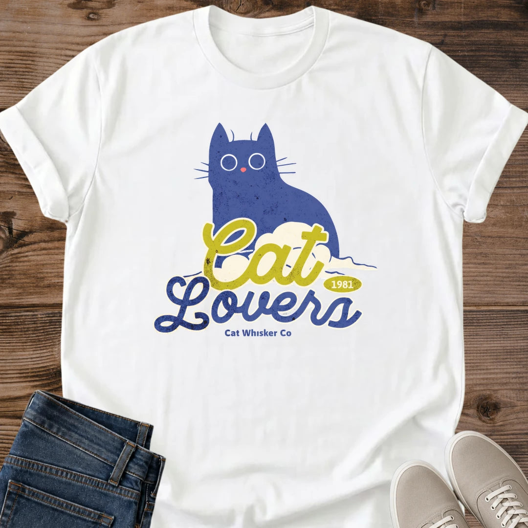Illustrated Cat Tee Soft Graphic Design Blue Cat Lover Shirt Comfortable Lightweight Fabric Whimsical Wide Eye Art Retro Typography Style Casual Weekend Wear Perfect Gift Idea Pet Parent Essential Everyday Comfort Statement Piece Lounging