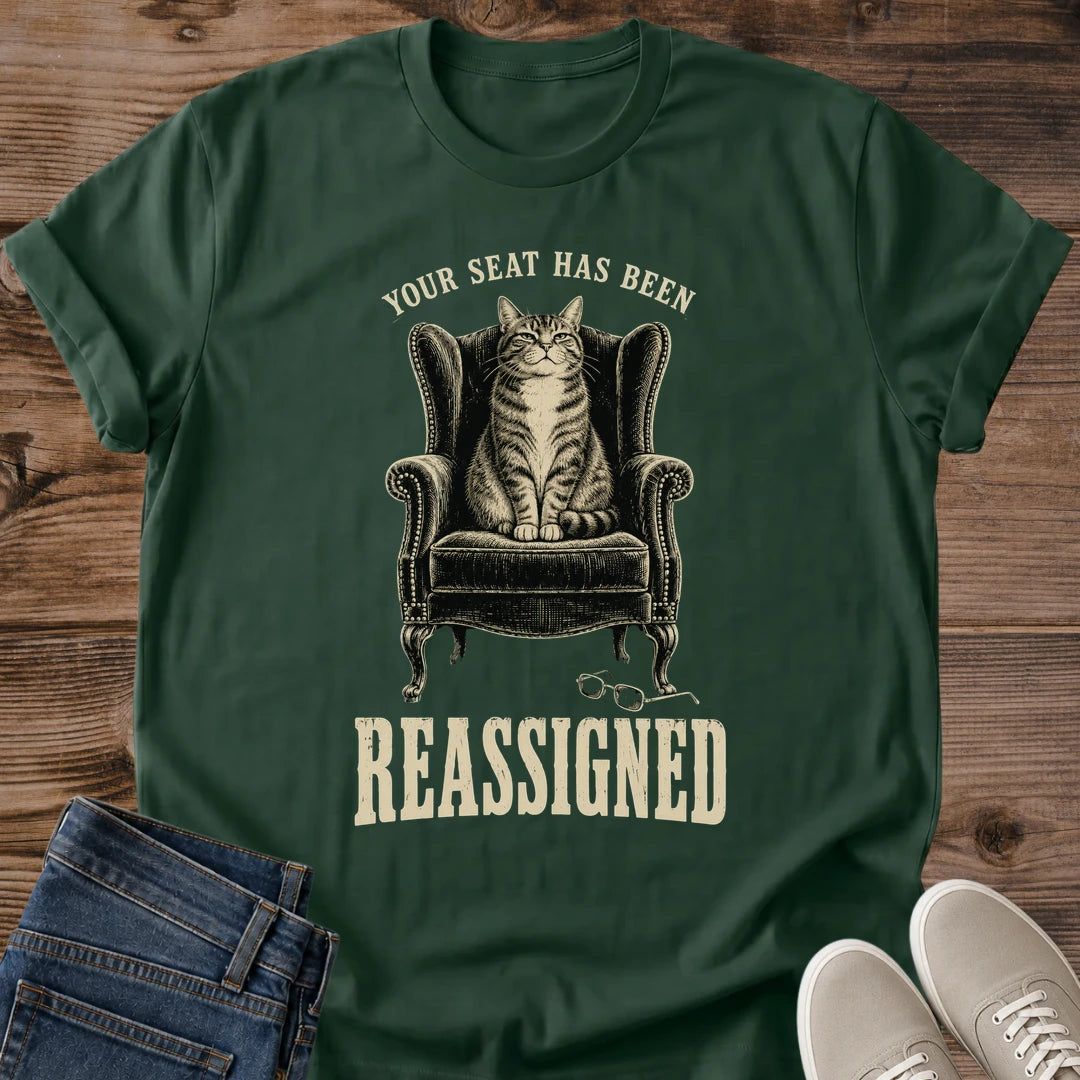 Forest GreenSarcastic Cat Shirt Your Seat Has Been Reassigned Funny Graphic Tee Cat In Armchair Glasses On Floor Vintage Design Cat Mom Gift Comfortable Softstyle Cotton Casual Everyday Wear Dry Humor Cat Owner Tee