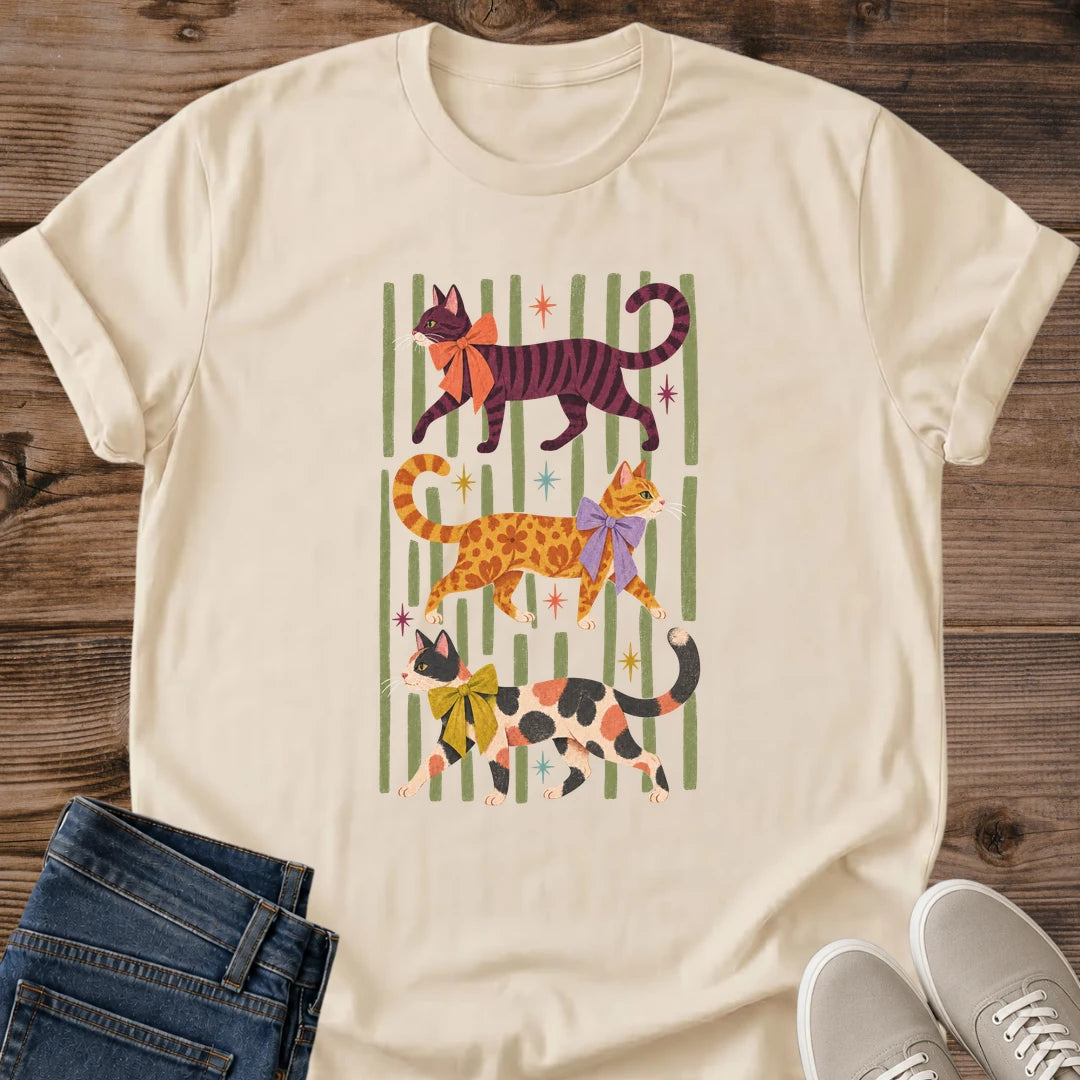 Cat Pattern Shirt Cats In Scarves Colorful Whimsical Tee Three Cats In Bright Bows Green Striped Backdrop Cat Lover Gift Softstyle Ring Spun Cotton Relaxed Unisex Fit Casual Wear Vintage Cat Art Tee