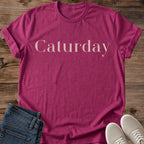 Cat Themed Clothing Caturday Script Tee Weekend Casual Shirt Comfortable Feline Fashion Statement Elegant Typography Design Lightweight Fabric Perfect Cat Lover Gift Cozy Weekend Style Animal Enthusiast Apparel Birthday Present Lounging