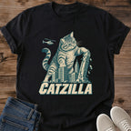 Black Catzilla funny cat shirt showing a giant tabby cat above a city skyline in vintage graphic style