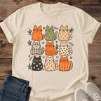 Autumn Cat Graphic Tee Warm Tone Design Hand Drawn Grid Collection Playful Cat Personalities Soft Cotton Fabric Breathable Comfortable Fit Casual Everyday Wear Relaxed Crew Neck Style Perfect Cat Lover Gift Present Cozy Artistic Print