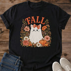 Cozy Fall Fashion Shirt Autumn Cat Graphic Design Seasonal Tee Black Fabric Base White Cat Illustration Floral Wreath Details Pumpkin Accent Elements Warm Seasonal Colors Casual Everyday Comfort Wear Perfect Autumn Wardrobe Essential