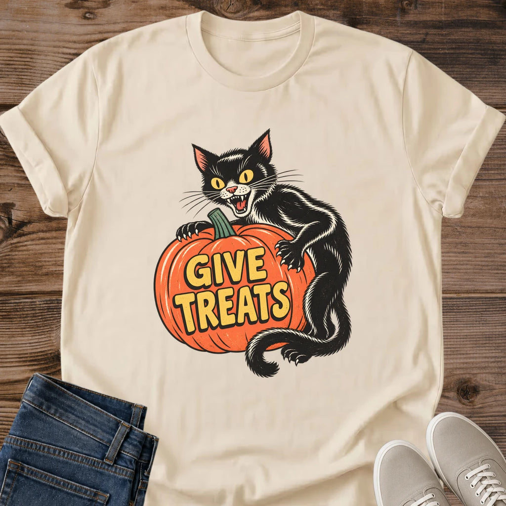 Sand Halloween T-shirt flat lay featuring a vintage-style black cat hugging an orange pumpkin with yellow Give Treats lettering.
