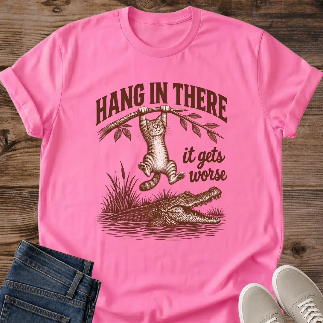 Azalea pink Hang In There Gator cat T-shirt with vintage tabby above an alligator and “It gets worse” sarcastic graphic