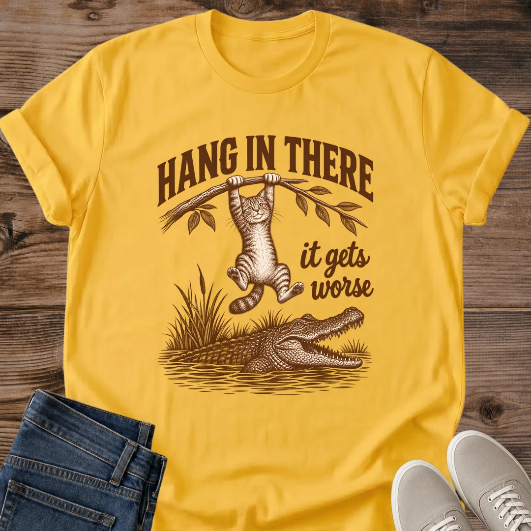 Daisy yellow Hang In There Gator cat T-shirt with vintage tabby above an alligator and “It gets worse” sarcastic graphic