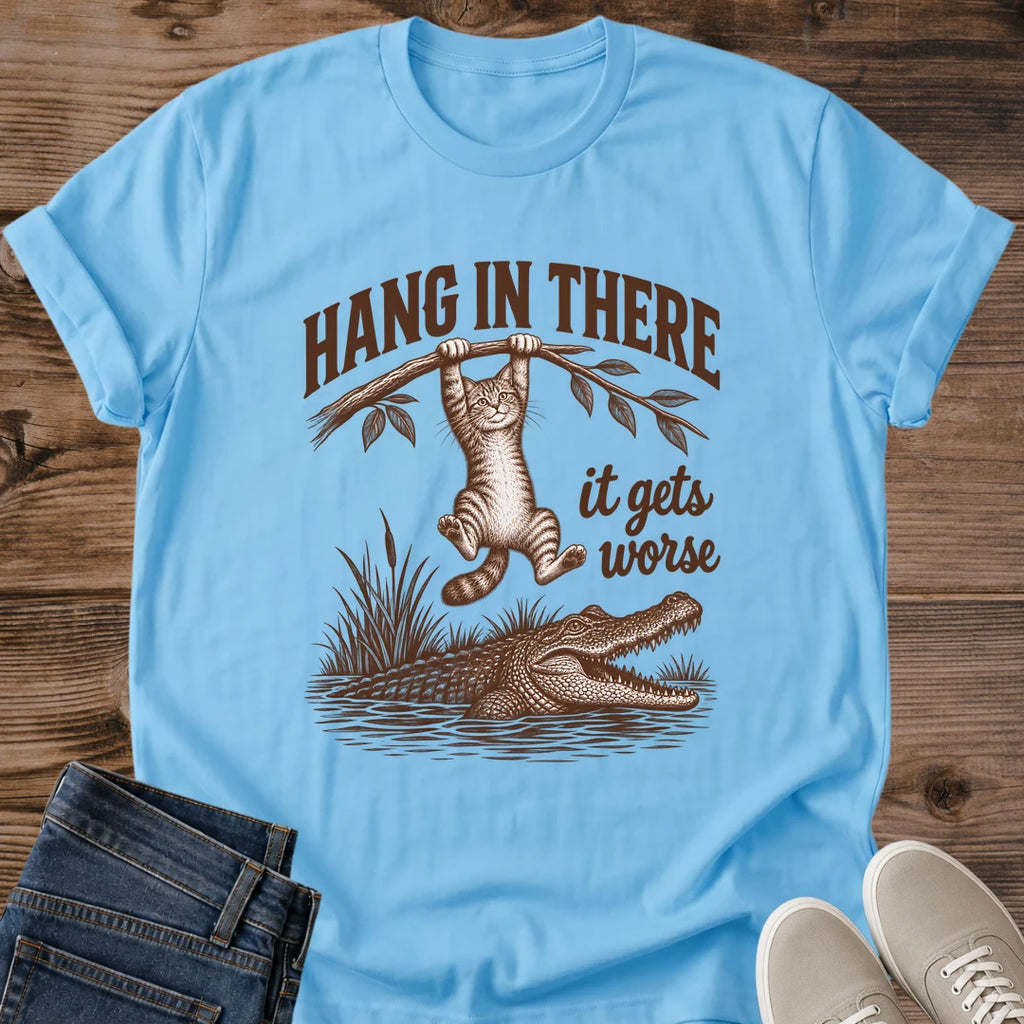 Sky blue Hang In There Gator cat T-shirt with vintage tabby above an alligator and “It gets worse” sarcastic graphic