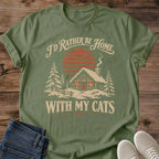 Winter Cat Shirt Cozy Cabin Sunset Snow Cottage Design Christmas Gift Idea Ring Spun Cotton Soft Breathable Fabric Relaxed Unisex Fit Vintage Print Cat Person Apparel Holiday Gift For Cat Lovers Everyday Wear Statement Piece
