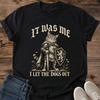 It Was Me I Let The Dogs Out Cat Shirt Black Funny Knight Cat Tee Medieval Tabby Cat In Armor With Shield Graphic Gothic Lettering Cat Shirt Mischievous Cat Meme Tee Cat Lover Gift Gildan 64000 Softstyle Unisex Cat Whisker Co