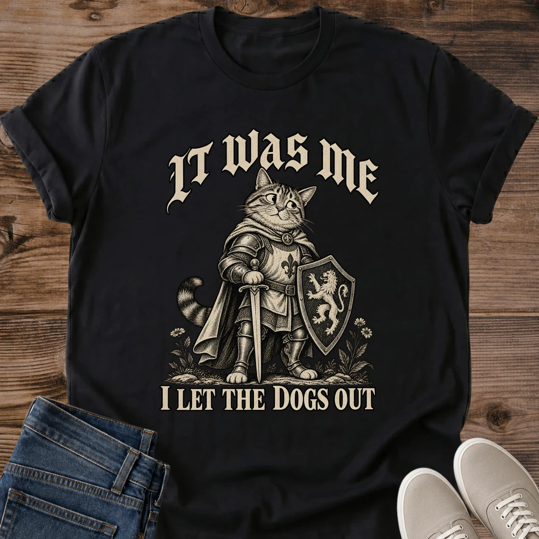 It Was Me I Let The Dogs Out Cat Shirt Black Funny Knight Cat Tee Medieval Tabby Cat In Armor With Shield Graphic Gothic Lettering Cat Shirt Mischievous Cat Meme Tee Cat Lover Gift Gildan 64000 Softstyle Unisex Cat Whisker Co