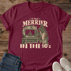 Maroon It Was Merrier in the 90s cat lover T-shirt featuring a cozy retro Christmas scene with cats and VHS-era television