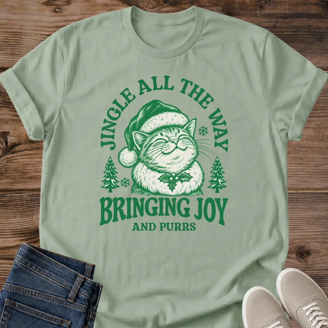 Santa Cat Shirt Bringing Joy And Purrs Tee Happy Cat In Santa Hat With Holly Illustration Pine Tree Christmas Design Cute Holiday Cat Mom Shirt Cat Owner Gift For Her Cat Dad Christmas Tee Soft Cotton Unisex Shirt Cat Whisker Co