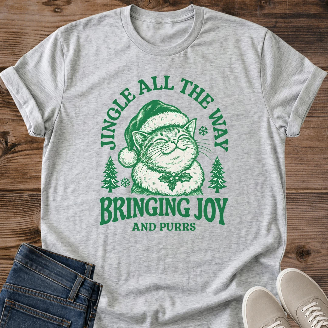 Santa Cat Shirt Bringing Joy And Purrs Tee Happy Cat In Santa Hat With Holly Illustration Pine Tree Christmas Design Cute Holiday Cat Mom Shirt Cat Owner Gift For Her Cat Dad Christmas Tee Soft Cotton Unisex Shirt Cat Whisker Co