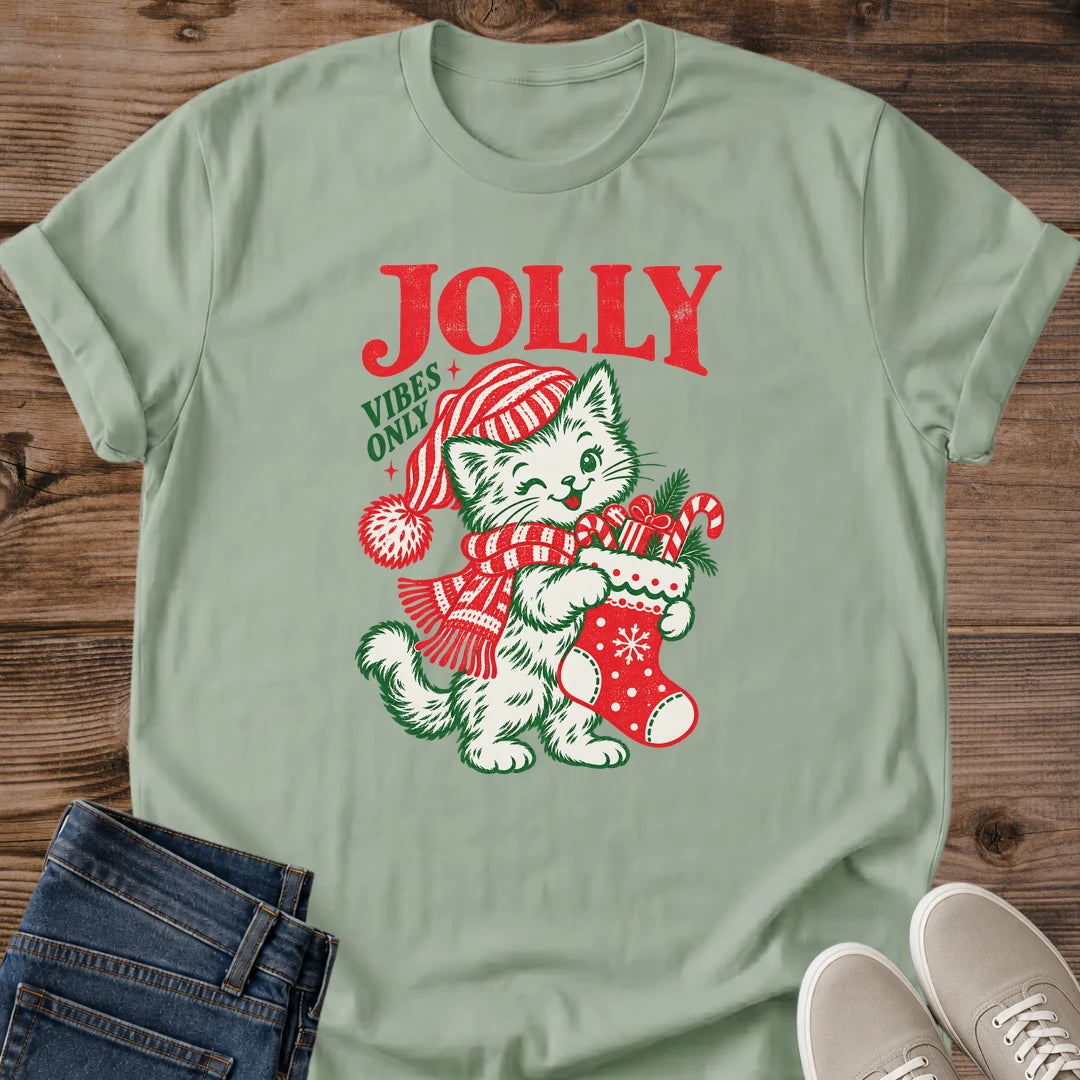 Sage green Jolly Vibes Only Christmas cat T-shirt featuring a holiday cat wearing a striped winter hat in vintage-inspired artwork