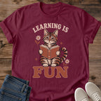 Retro Cat Tee Vintage Reading Book Design Graphic Shirt For Book Lover Teacher Gift Soft Fabric Lightweight Style Casual Wear Literary Apparel Cozy Reading Outfit Bookworm Clothing Tabby Cat Illustration Earth Tone Colors Nostalgic Design
