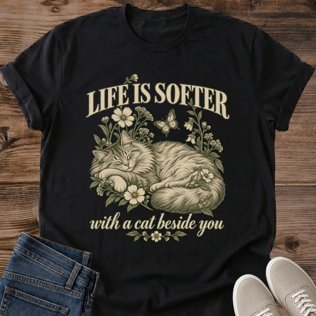 Life Is Softer With A Cat Beside You Shirt Black Cozy Cat Quote Tee Fluffy Cat Sleeping In Wildflowers Graphic Vintage Floral Cat Shirt Sentimental Cat Mom Gift Life Is Better With Cats Tee Gildan 64000 Softstyle Unisex Cat Whisker Co