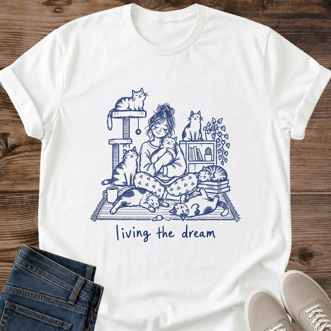 Multi Cat Mom Shirt Living The Dream Tee Girl In Pajamas Cuddling Cats With Cat Tree Books And Coffee Illustration Hand Drawn Navy Ink Design Cat Owner Gift For Her Cozy Weekend Tee Crowd Of Cats Soft Cotton Unisex Shirt Cat Whisker Co