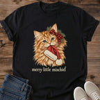 Black Merry Little Mischief Christmas cat T-shirt flat lay featuring an orange tabby with a red plaid bow holding a Santa hat.