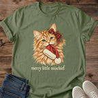 Military green Merry Little Mischief Christmas cat T-shirt flat lay featuring an orange tabby with a red plaid bow holding a Santa hat.