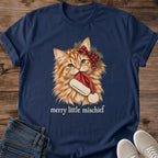 Navy Merry Little Mischief Christmas cat T-shirt flat lay featuring an orange tabby with a red plaid bow holding a Santa hat.