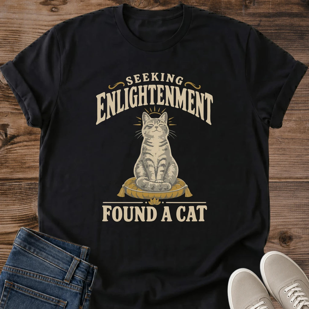 Vintage Style Cat Tee Spiritual Humor Graphic Shirt Seeking Enlightenment Design Funny Cat Lover Gift Lightweight Cotton Fabric Comfortable Casual Wear Muted Warm Tones Dark Background Centered Cat Illustration Quirky Novelty Shirt Everyday