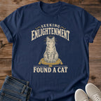 Funny Cat Shirt Vintage Style Graphic Tee Spiritual Humor Design Seeking Enlightenment Found Cat Message Perfect Cat Lover Gift Soft Cotton Fabric Comfortable Everyday Wear Dark Background Muted Tones Centered Illustration Quirky Statement