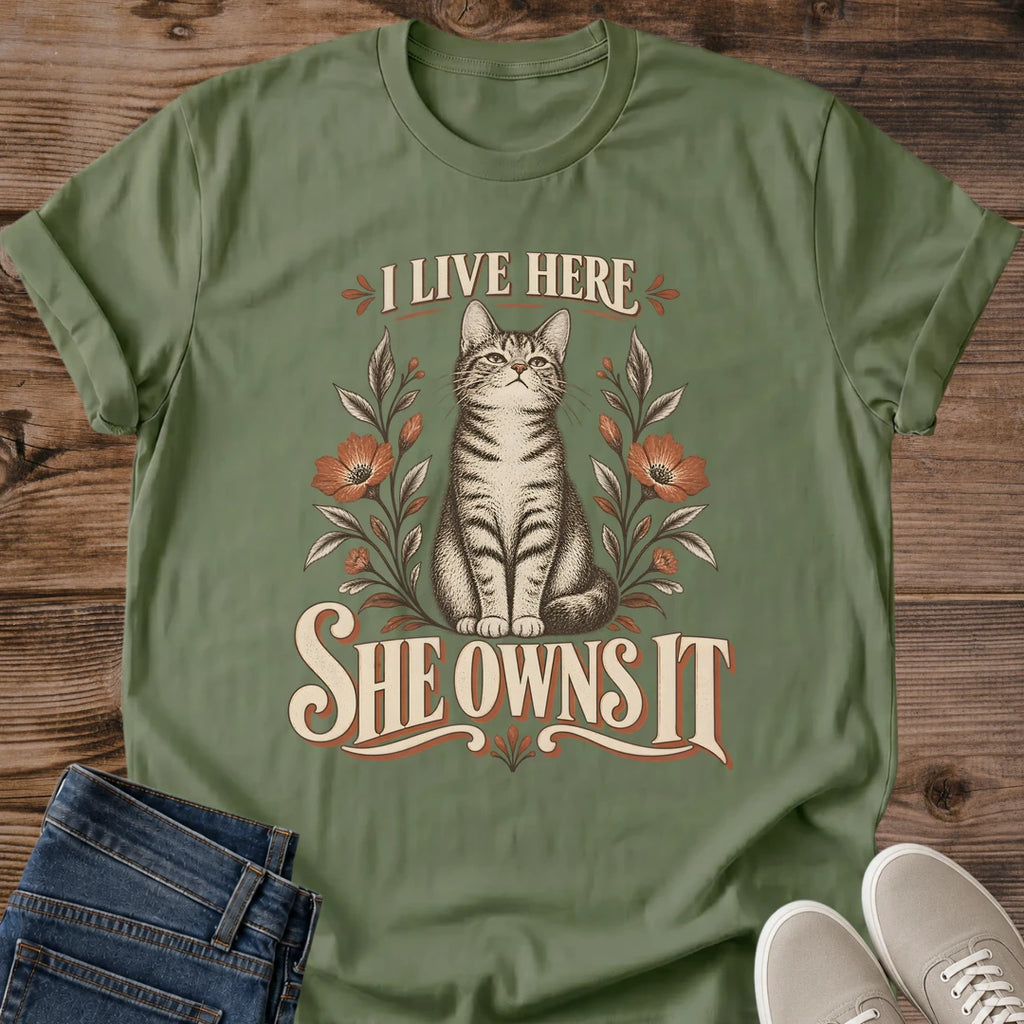 I Live Here She Owns It Cat Shirt Funny Floral Cat Tee Cat Lover Gift Idea Softstyle Ring Spun Cotton Relaxed Fit Everyday Casual Wear Vintage Print Cat Owner Apparel Statement Piece Lightweight Layering For Home