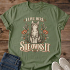I Live Here She Owns It Cat Shirt Funny Floral Cat Tee Cat Lover Gift Idea Softstyle Ring Spun Cotton Relaxed Fit Everyday Casual Wear Vintage Print Cat Owner Apparel Statement Piece Lightweight Layering For Home