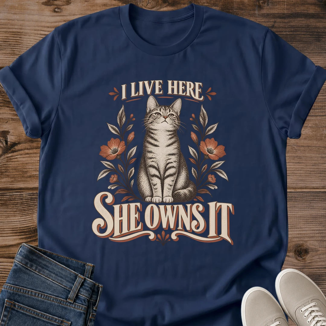 Funny Cat Home Shirt I Live Here She Owns It Floral Graphic Tee Gift Idea Ring Spun Cotton Soft Breathable Fabric Relaxed Unisex Fit Vintage Print Design Cat Person Apparel Casual Everyday Wear Statement Piece Great Gift