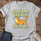 Orange Cat Shirt Slow And Steady Tee Confident Ginger Tabby Strutting Illustration Bold Yellow Retro Lettering Motivational Cat Shirt Cat Owner Gift For Her Cat Dad Tee Orange Tabby Lover Gift Soft Cotton Unisex Shirt Cat Whisker Co
