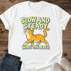 Slow And Steady Wins The Race Cat Shirt White Orange Tabby Cat Tee Funny Ginger Cat Graphic Retro Cartoon Cat Shirt Orange Cat Energy Tee Slow Runner Gift Cat Lover Gift Cat Mom Shirt Gildan 64000 Softstyle Unisex Cat Whisker Co