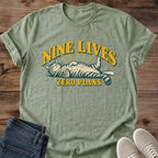 Nine Lives Zero Plans Cat Shirt Vintage Badge Graphic Tee Laid Back Cat Lover Gift Idea Softstyle Ring Spun Cotton Relaxed Fit Everyday Casual Wear Retro Print Cat Owner Apparel Statement Piece Lightweight Layering For Home