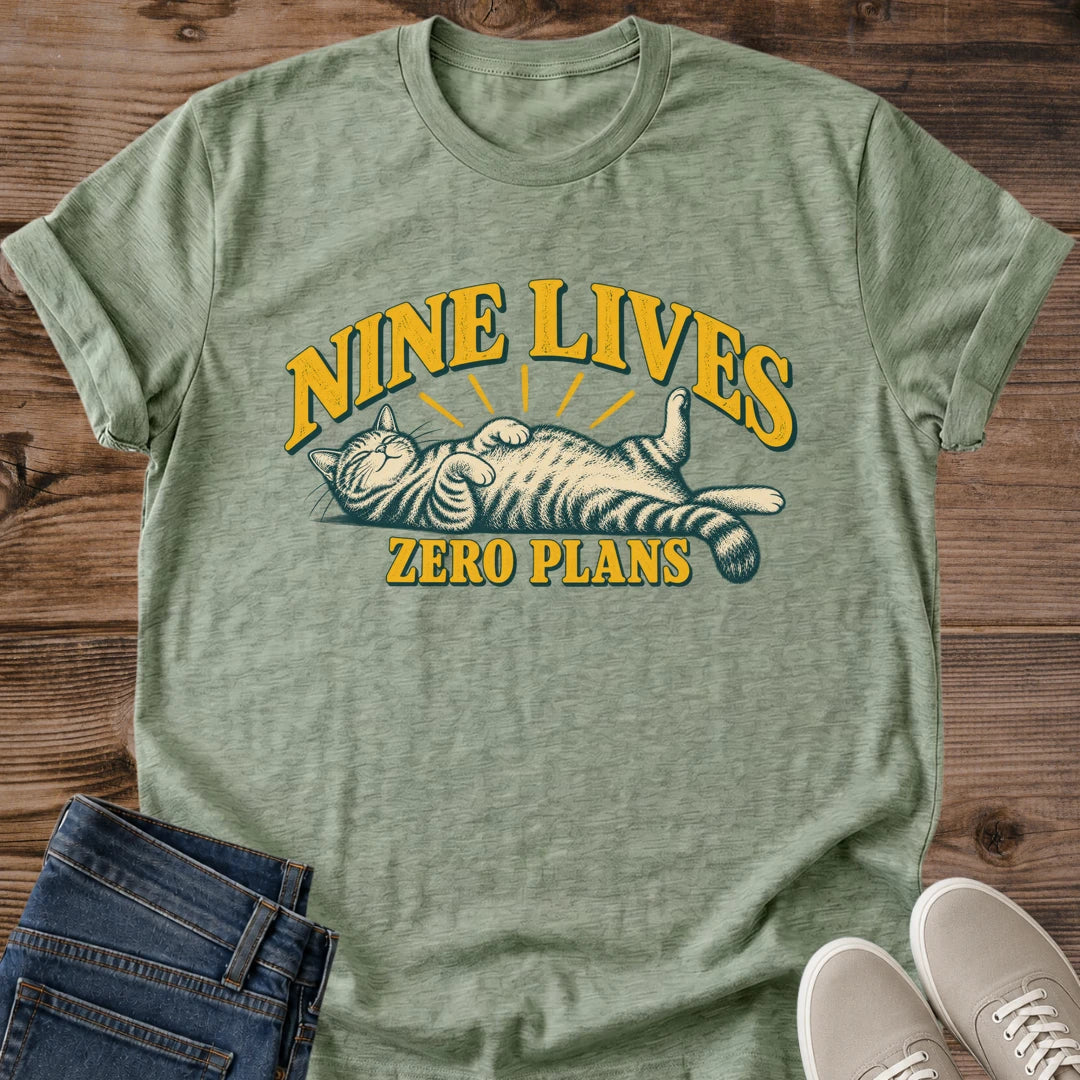 Nine Lives Zero Plans Cat Shirt Vintage Badge Graphic Tee Laid Back Cat Lover Gift Idea Softstyle Ring Spun Cotton Relaxed Fit Everyday Casual Wear Retro Print Cat Owner Apparel Statement Piece Lightweight Layering For Home