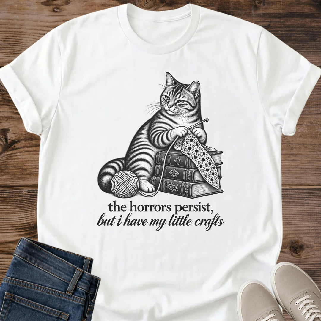 The Horrors Persist But I Have My Little Crafts Shirt White Funny Knitting Cat Tee Tabby Cat Knitting On Stack Of Books Graphic Vintage Sketch Crafter Shirt Crochet Lover Gift Cat Mom Gift Gildan 64000 Softstyle Unisex Cat Whisker Co