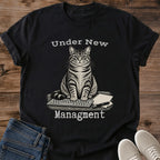 Dark Chocolate Funny Cat Shirt Featuring Tabby Cat Taking Over The Desk Sitting On Keyboard With Pen And Papers Under New Management Quote WFH Cat Tee Remote Worker Gift Cat Mom Shirt Cat Dad Shirt Cat Whisker Co