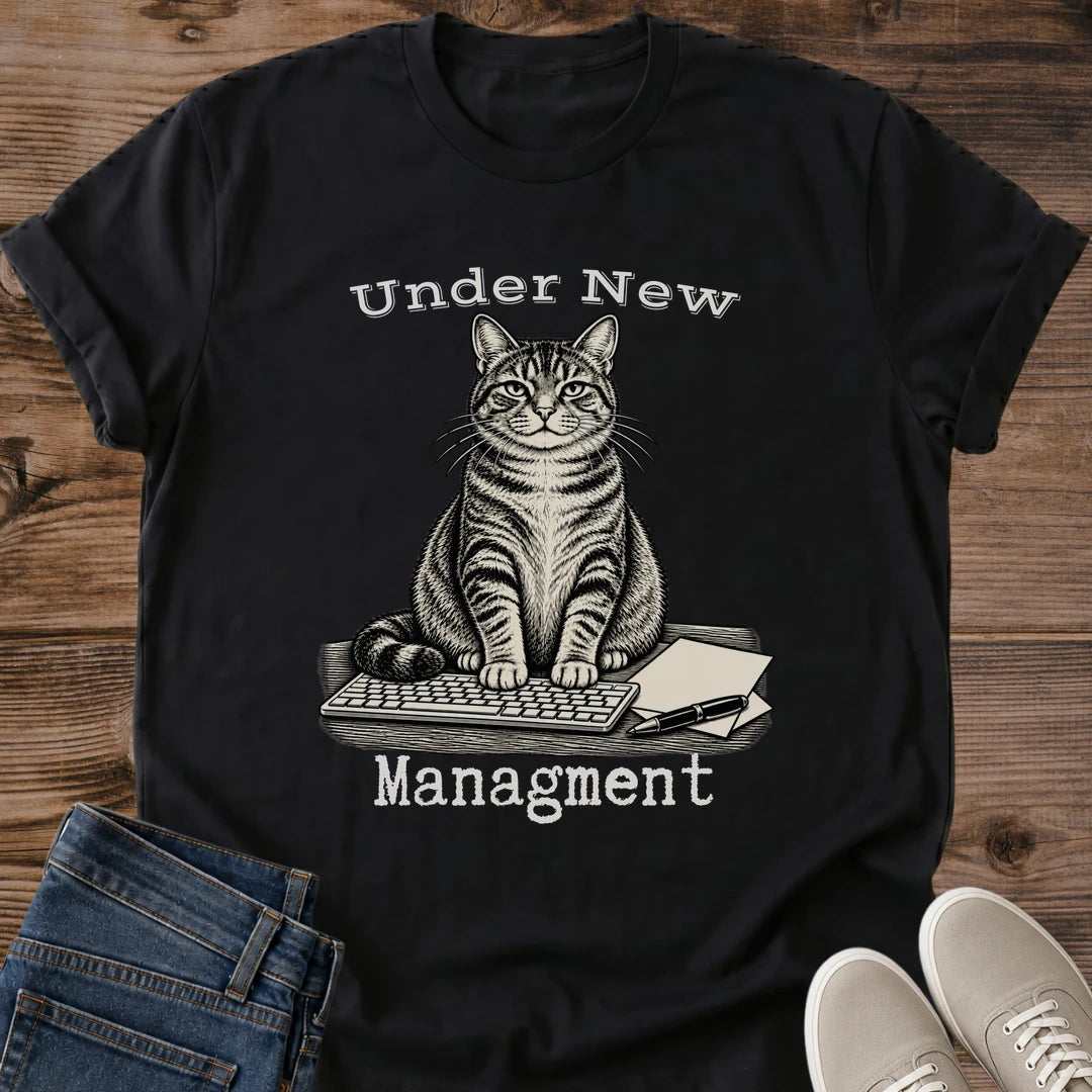 Dark Chocolate Funny Cat Shirt Featuring Tabby Cat Taking Over The Desk Sitting On Keyboard With Pen And Papers Under New Management Quote WFH Cat Tee Remote Worker Gift Cat Mom Shirt Cat Dad Shirt Cat Whisker Co