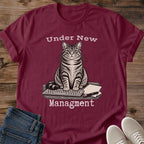 Close Up Collar View Of Under New Management Cat Tee Showing Typewriter Style Lettering On Soft Gildan 64000 Softstyle Unisex Shirt Funny Cat On Keyboard Design Office Cat Shirt White Elephant Gift Cat Whisker Co