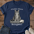Under New Management Cat Shirt In Black Funny Work From Home Tee With Vintage Engraved Tabby Cat Sitting On A Keyboard And Paperwork Typewriter Lettering Cat Boss Graphic Tee Gildan 64000 Softstyle Cat Whisker Co